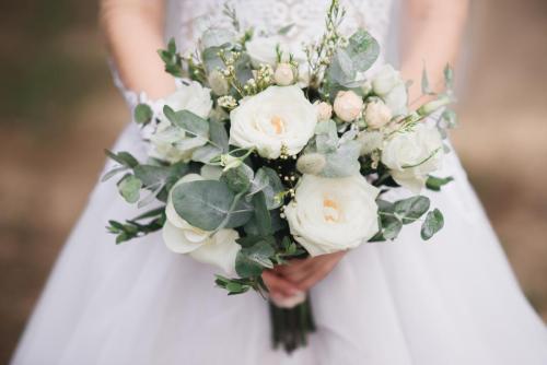 Bridal morning details. Wedding bouquet in the hands of the bride, selectoin focus